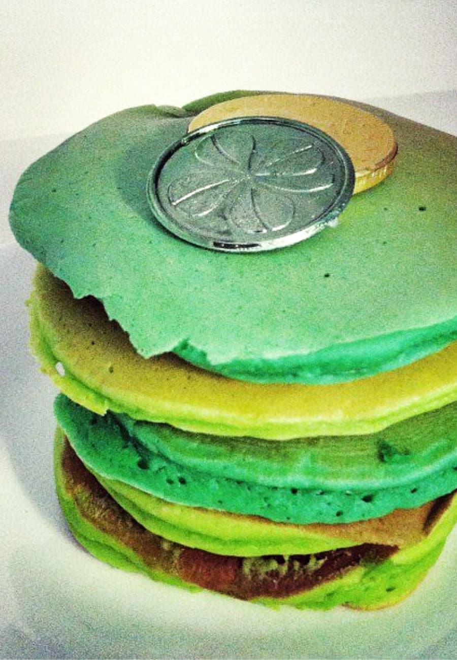 Stack of green pancakes on a plate