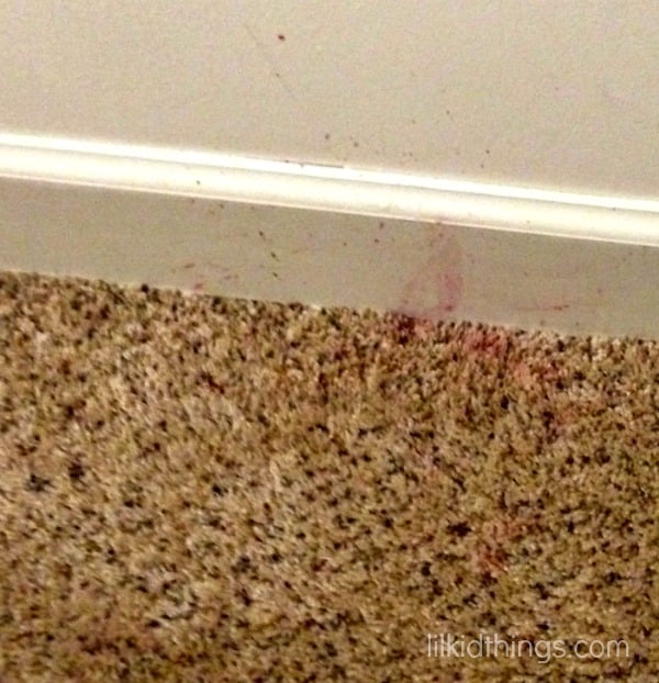 Spilled red wax all over the curtains and carpet did you? Try this super simple trick for cleaning wax stains out of both the carpet and fabric and save your sanity!