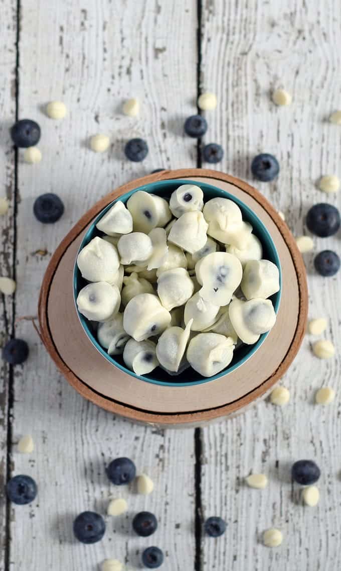 white chocolate covered blueberries in a bowl