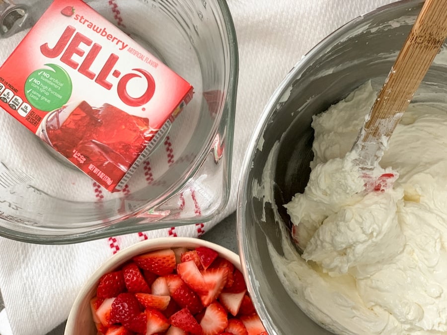 Strawberries and Jello in mixing bowls