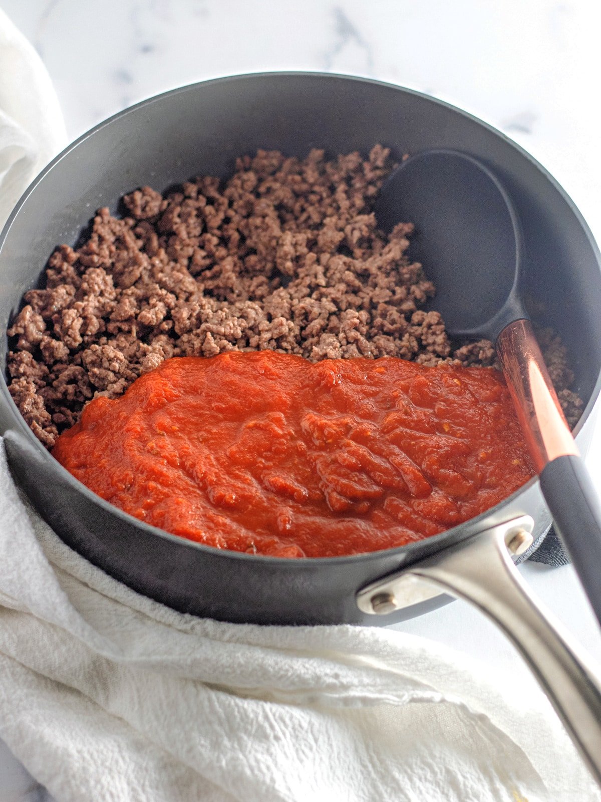 cooked ground beef and sauce in pan