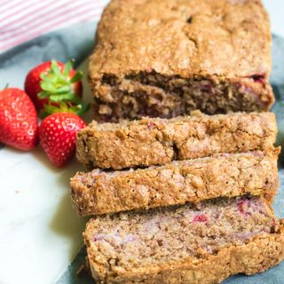 strawberry bread loaf sliced with fresh strawberries