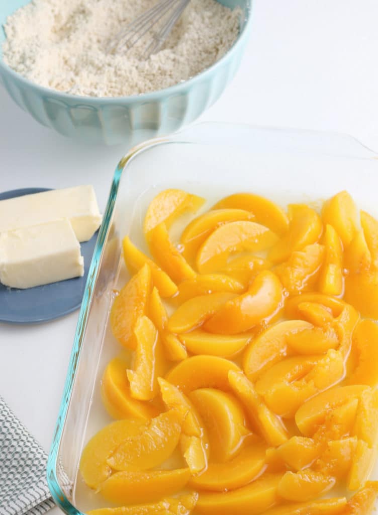 peaches in pan surrounded by other ingredients 