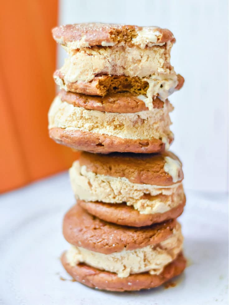Pumpkin Ice Cream Sandwiches with a bite taken out of one
