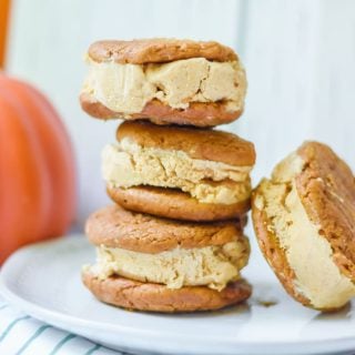 Pumpkin Ice Cream Sandwiches stacked on a plate