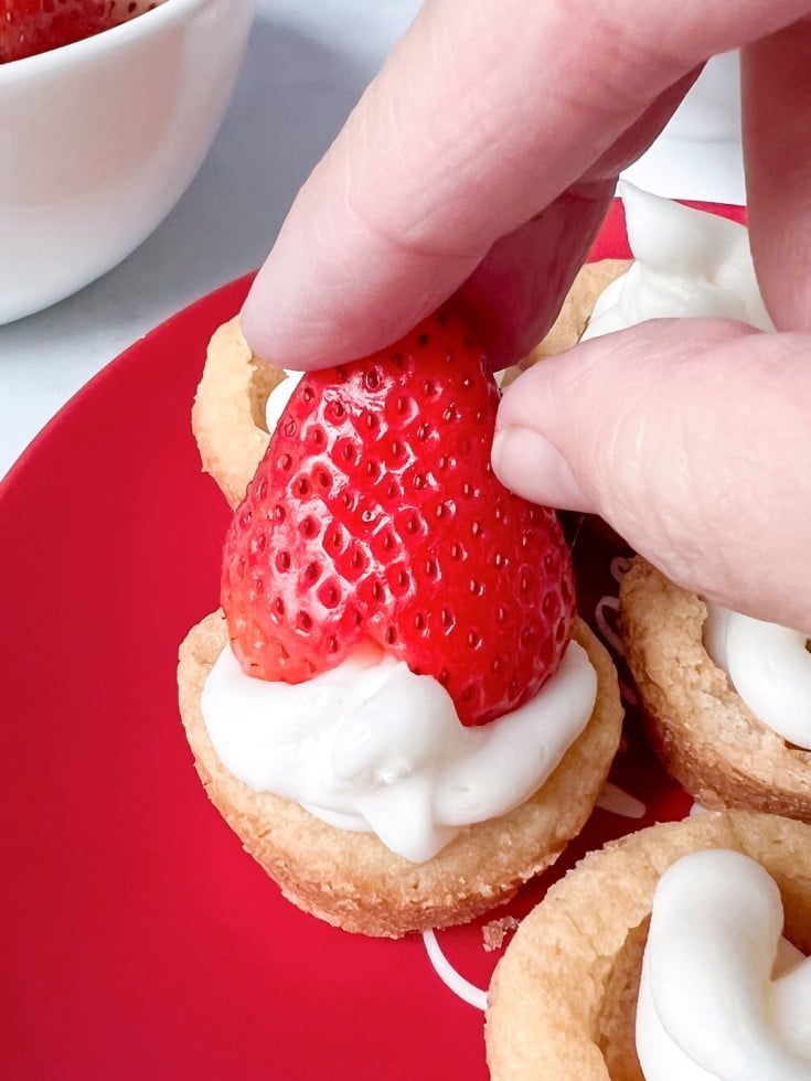 add strawberry to frosted cookie
