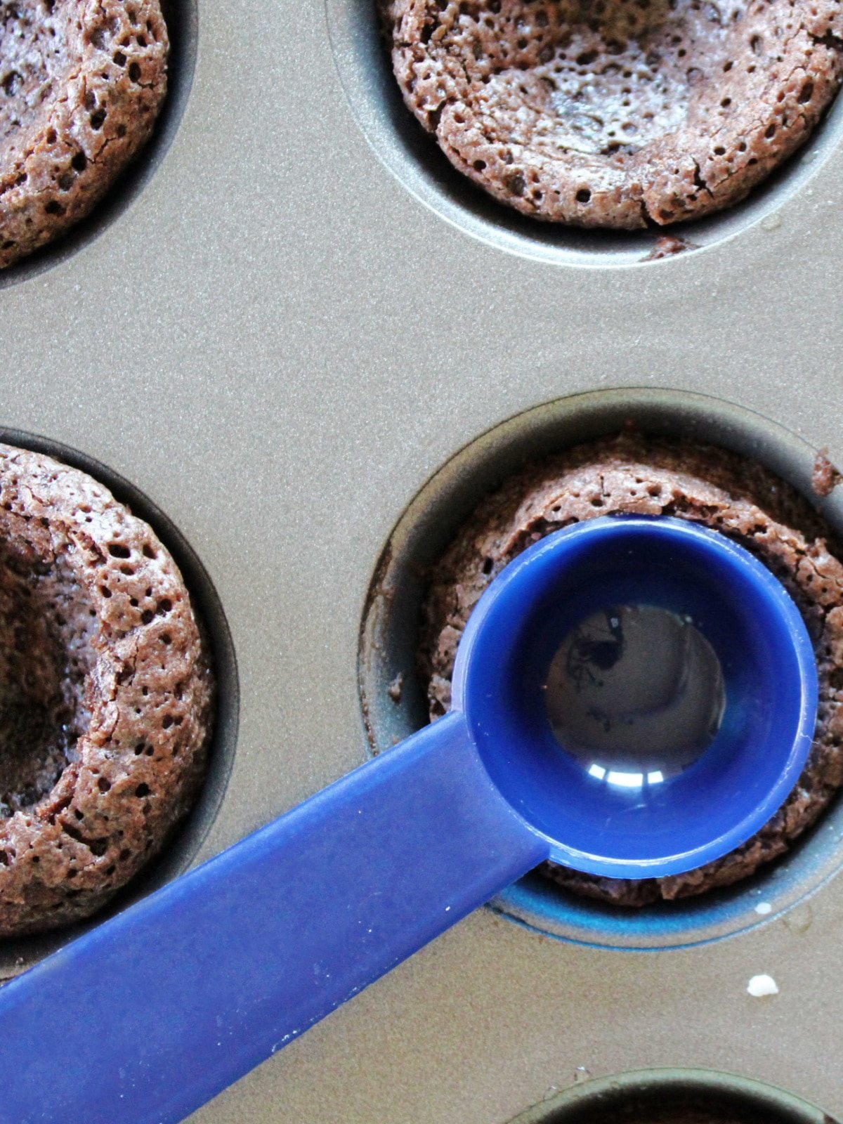press spoon to create brownie cup