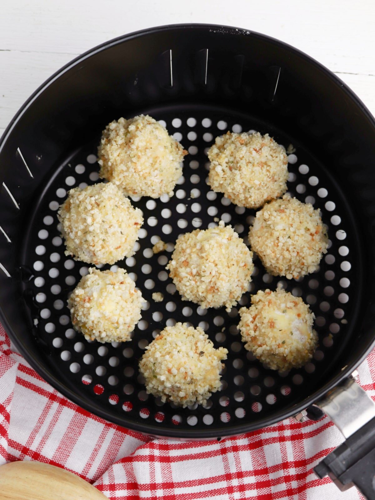 place pepperoni balls in air fryer basket