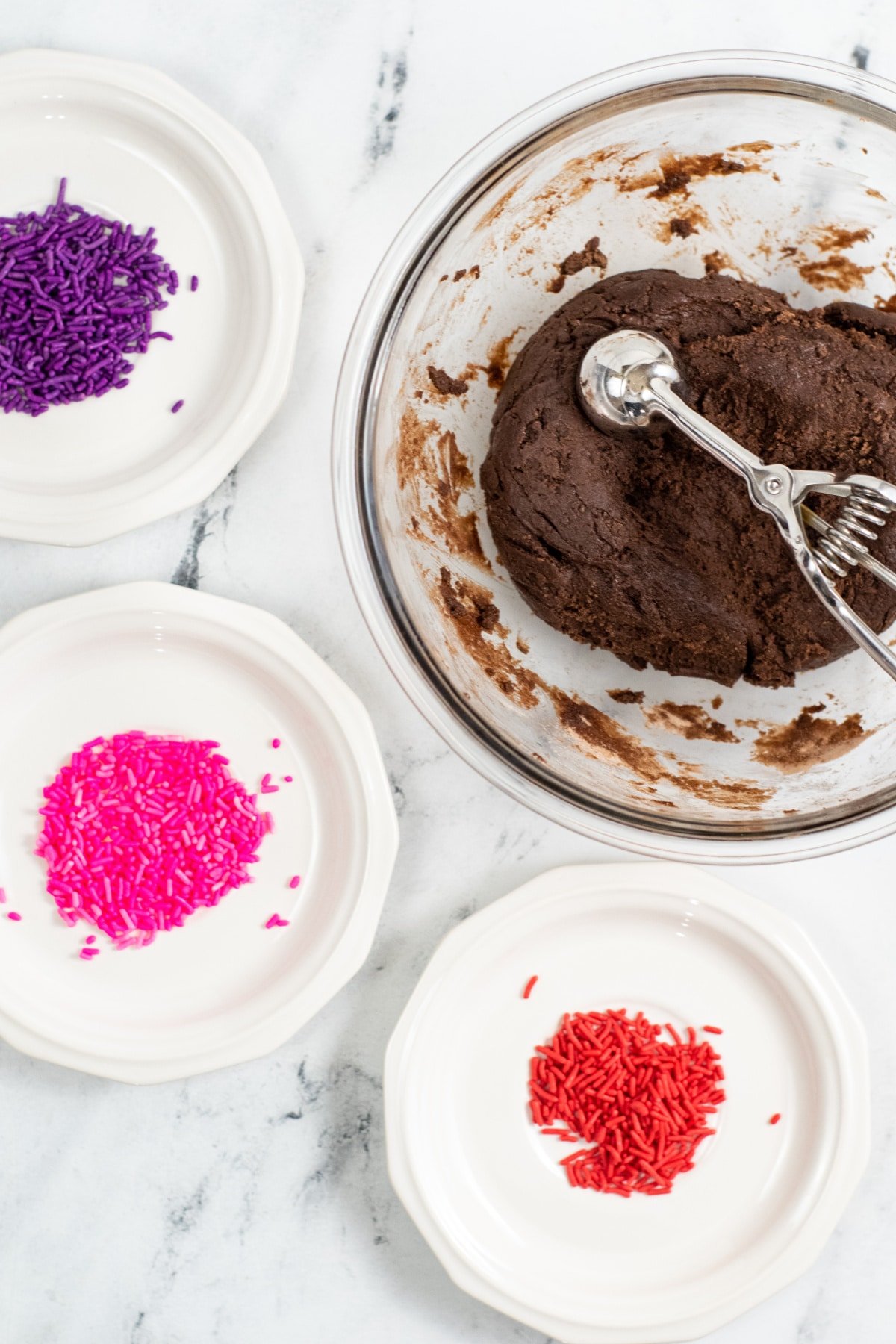 scoop brownie bites and roll in valentine sprinkles
