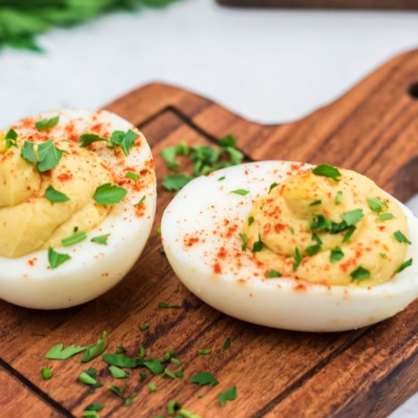 Hummus Eggs Serving On Cutting Board