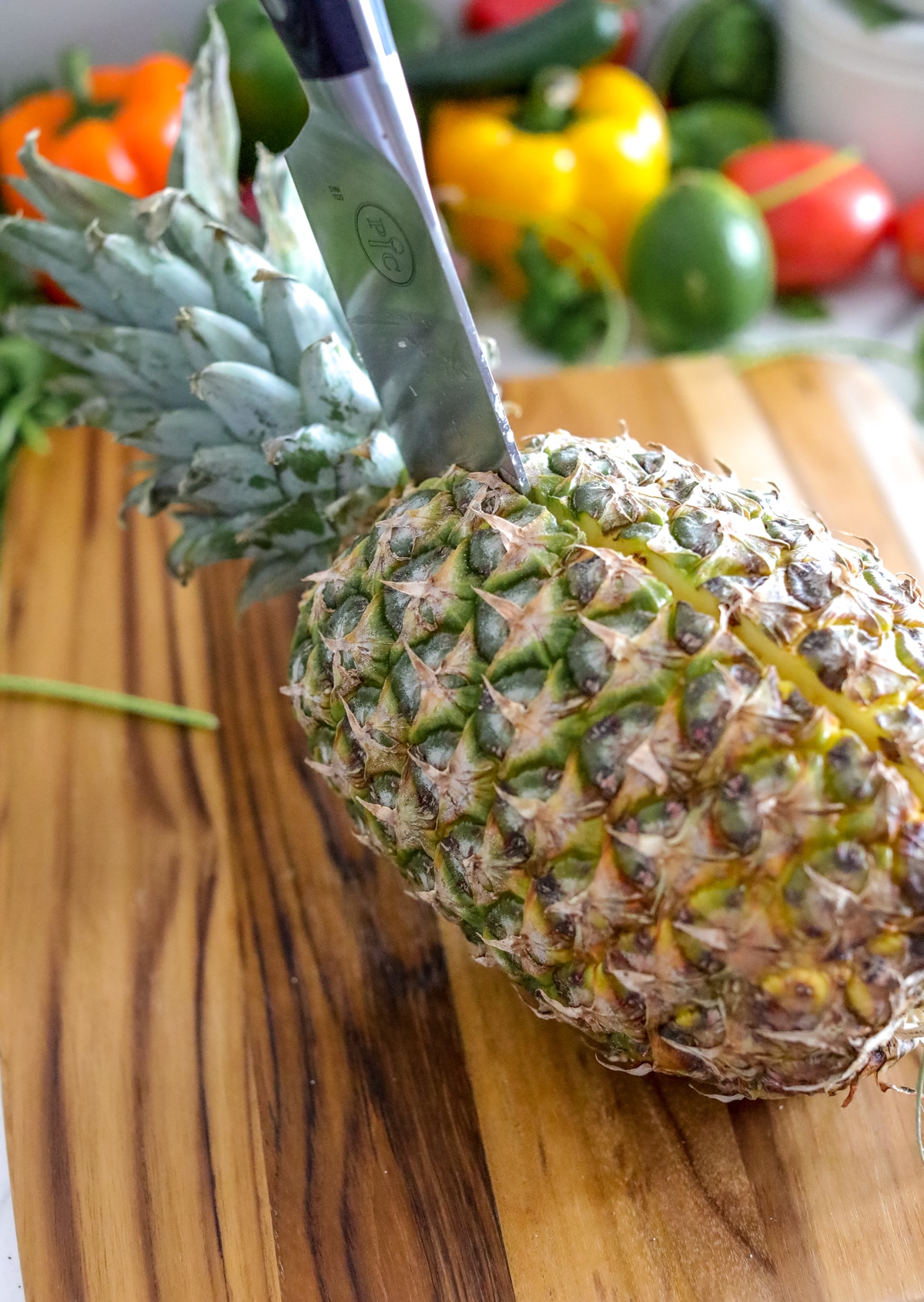 Slice Pineapple lengthwise with a knife