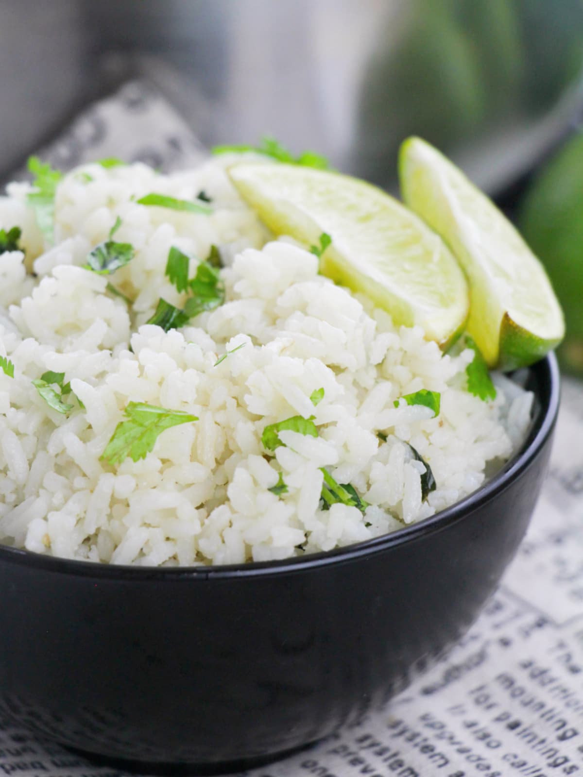 cilantro lime rice in bowl with lime wedges