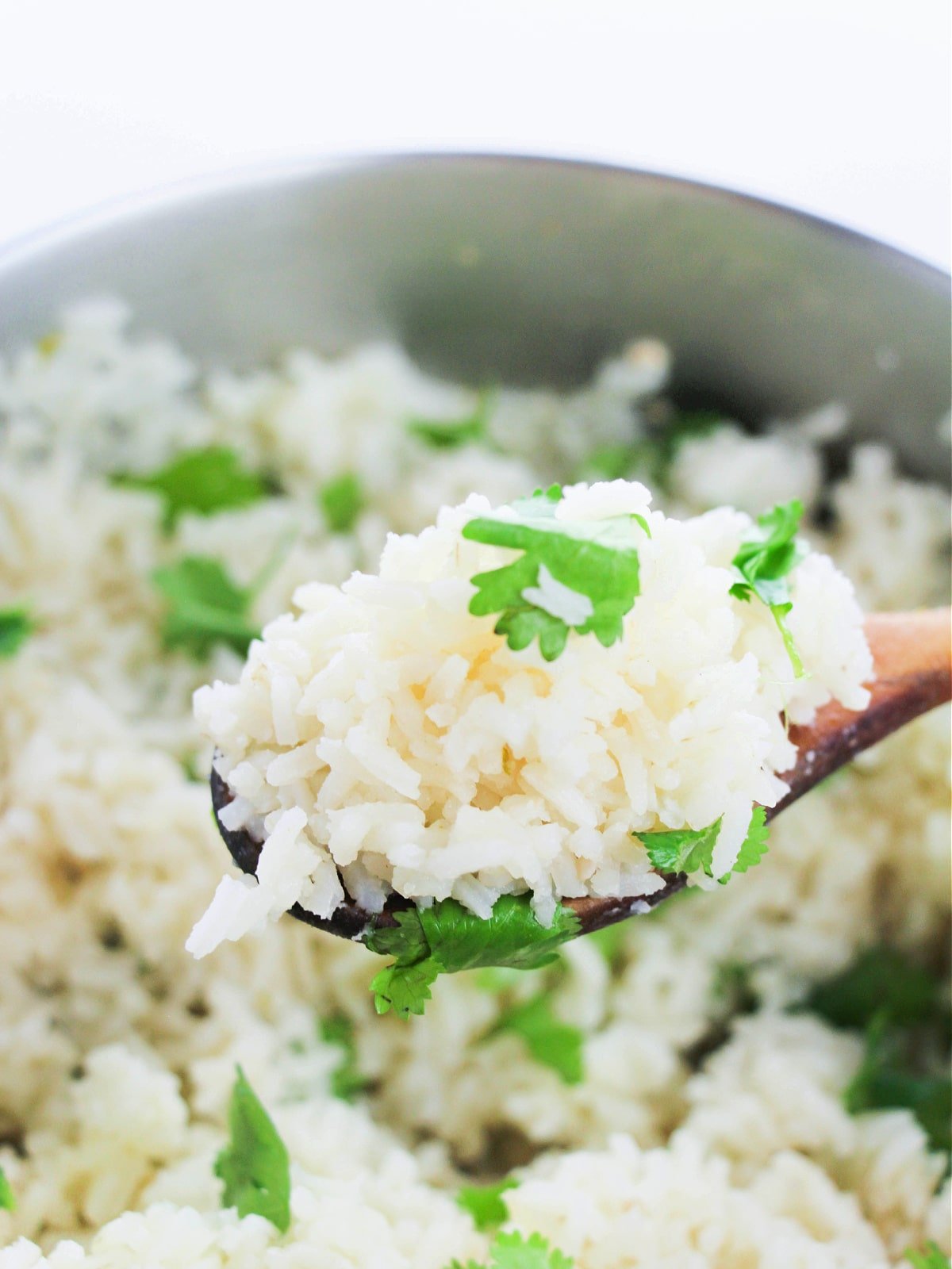 cilantro lime rice on wooden spoon