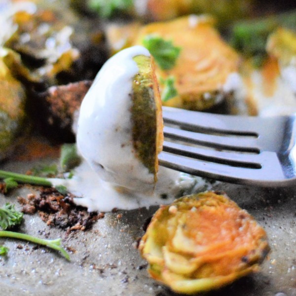 Buffalo Ranch Brussel Sprouts Bite on Fork with ranch dressing