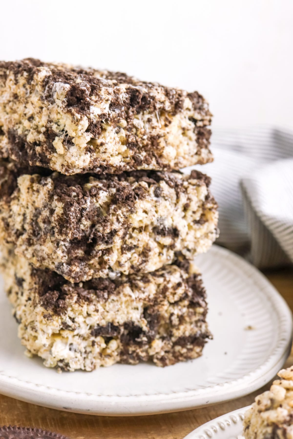 Cookies and Cream Rice Krispie Treats stacked on a plate