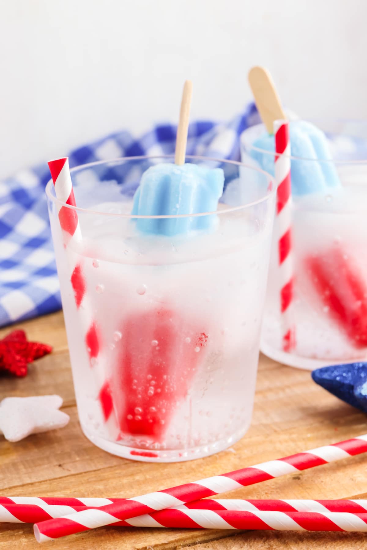 bomb pop mocktail with a red and white straw