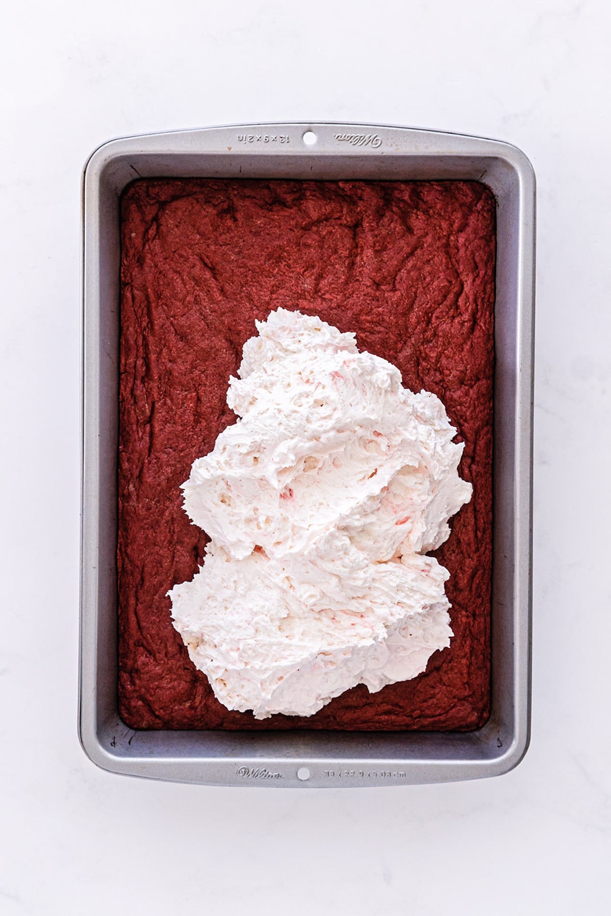 red velvet layer with cheesecake spread on top