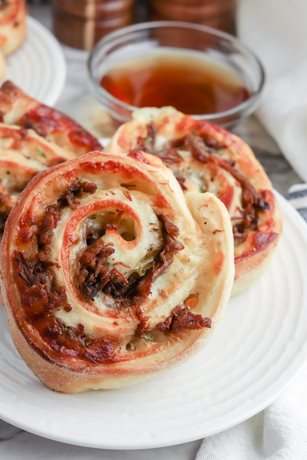serve italian beef pinwheels with reserved broth