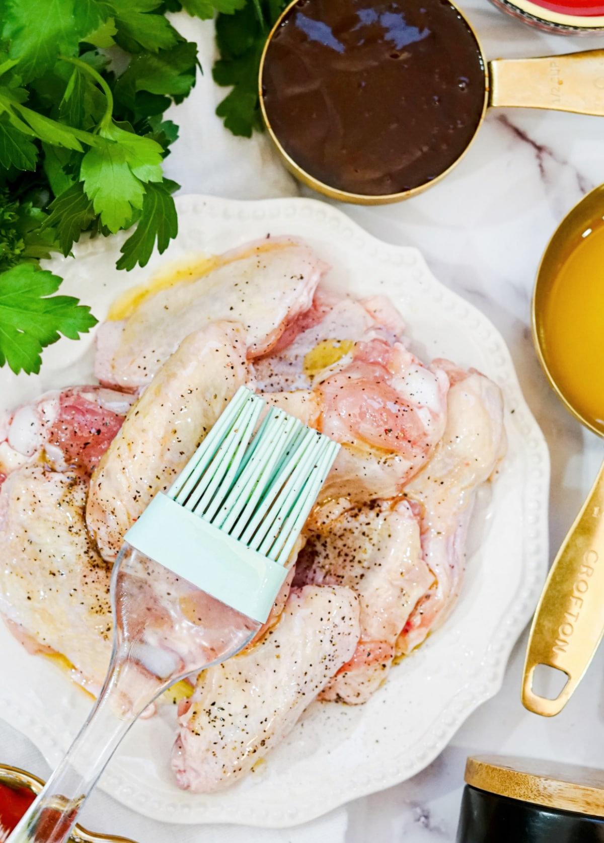 brush wings with butter and season