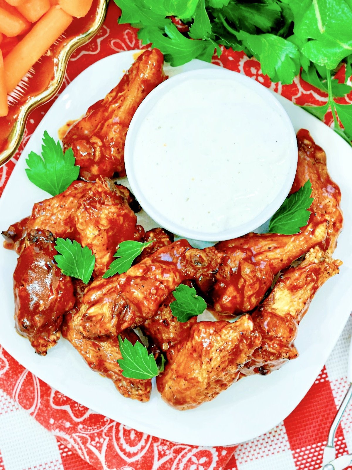spicy chicken wings on a plate with dip