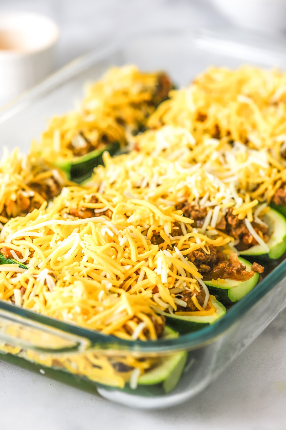 top Taco Zucchini Boats with shredded cheese
