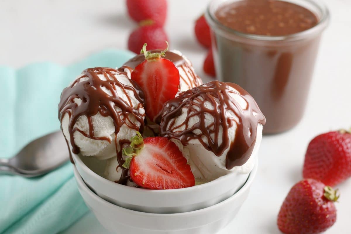 Hot Fudge Sauce on ice cream with strawberries