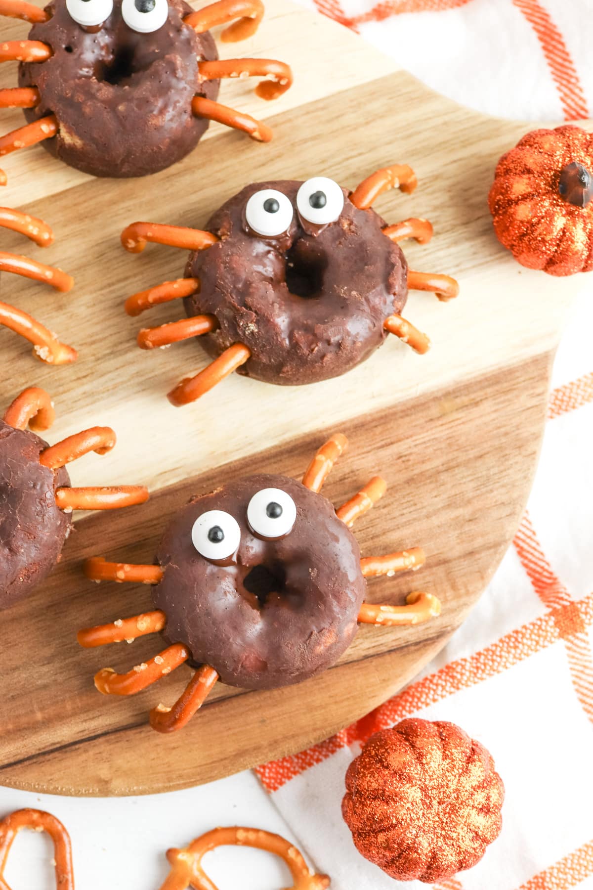 spider donuts on wood tray