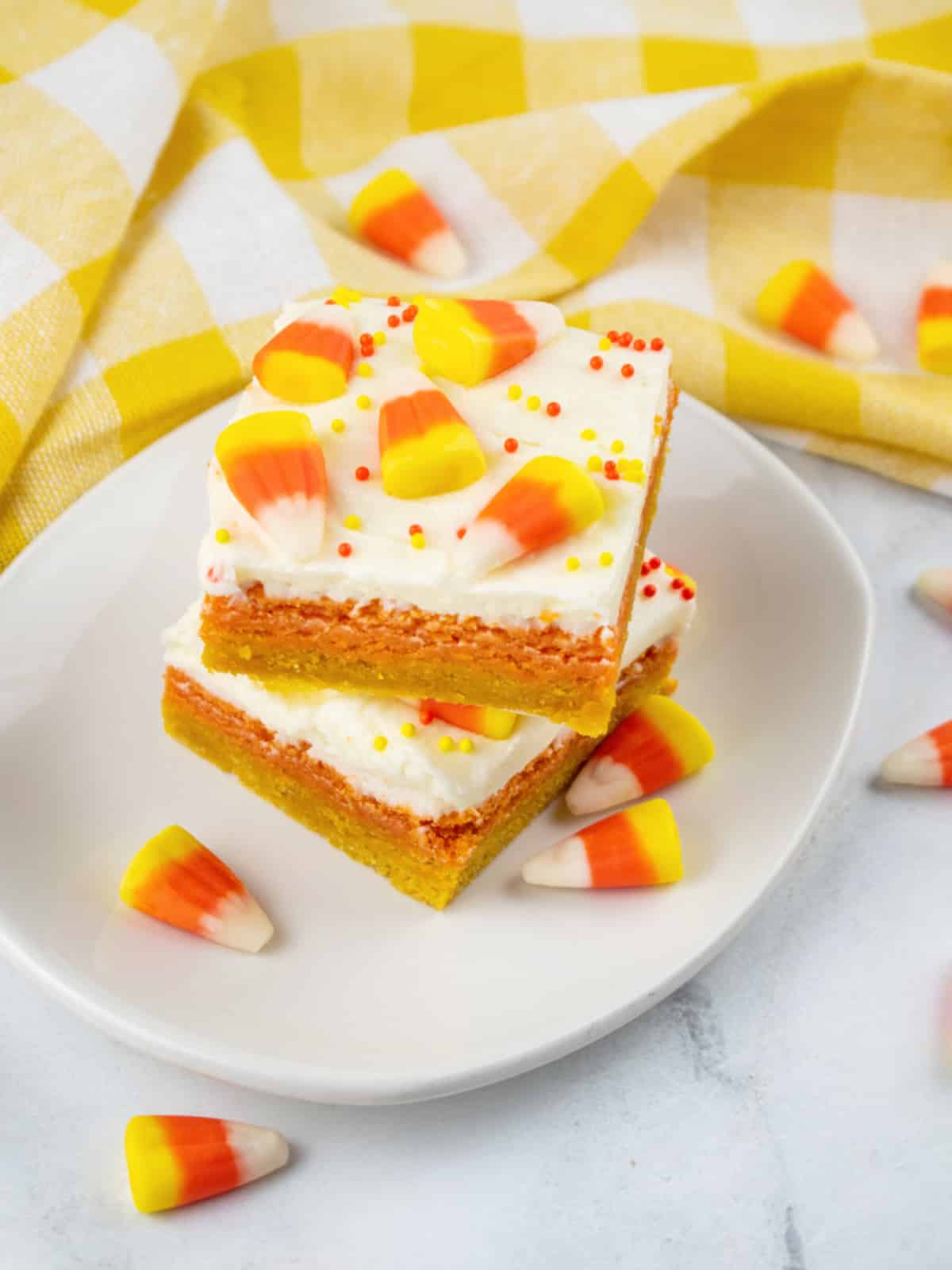 sugar cookie bars with candy corn on a plate
