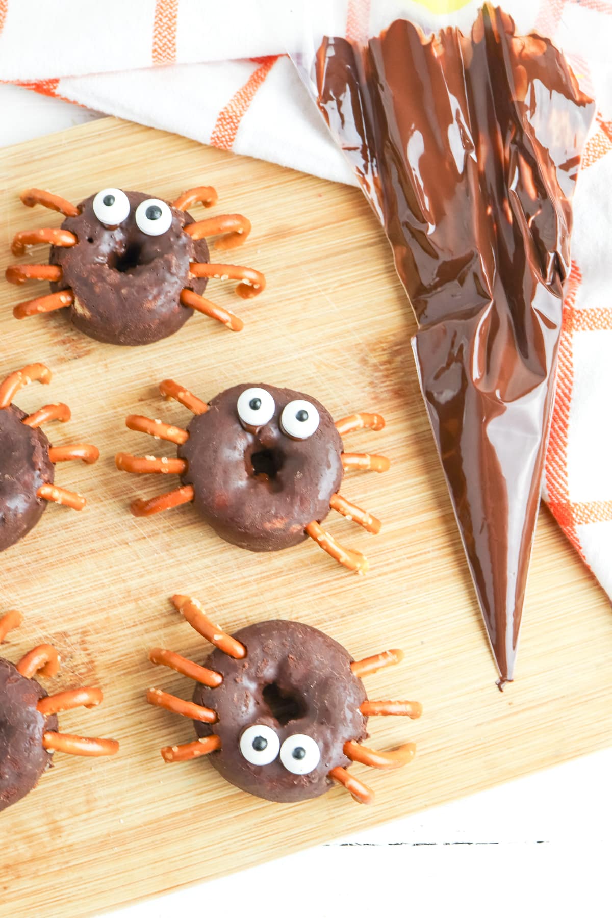 use melted chocolate to adhere candy eyes