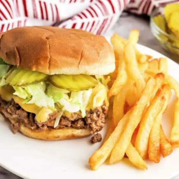 The Easiest Big Mac Sloppy Joes served with fried on the side in a white plate.