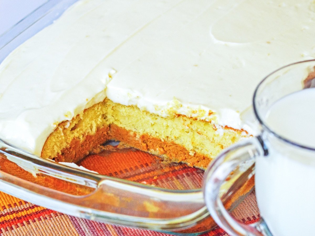 Pumpkin Magic Cake in pan with slices missing