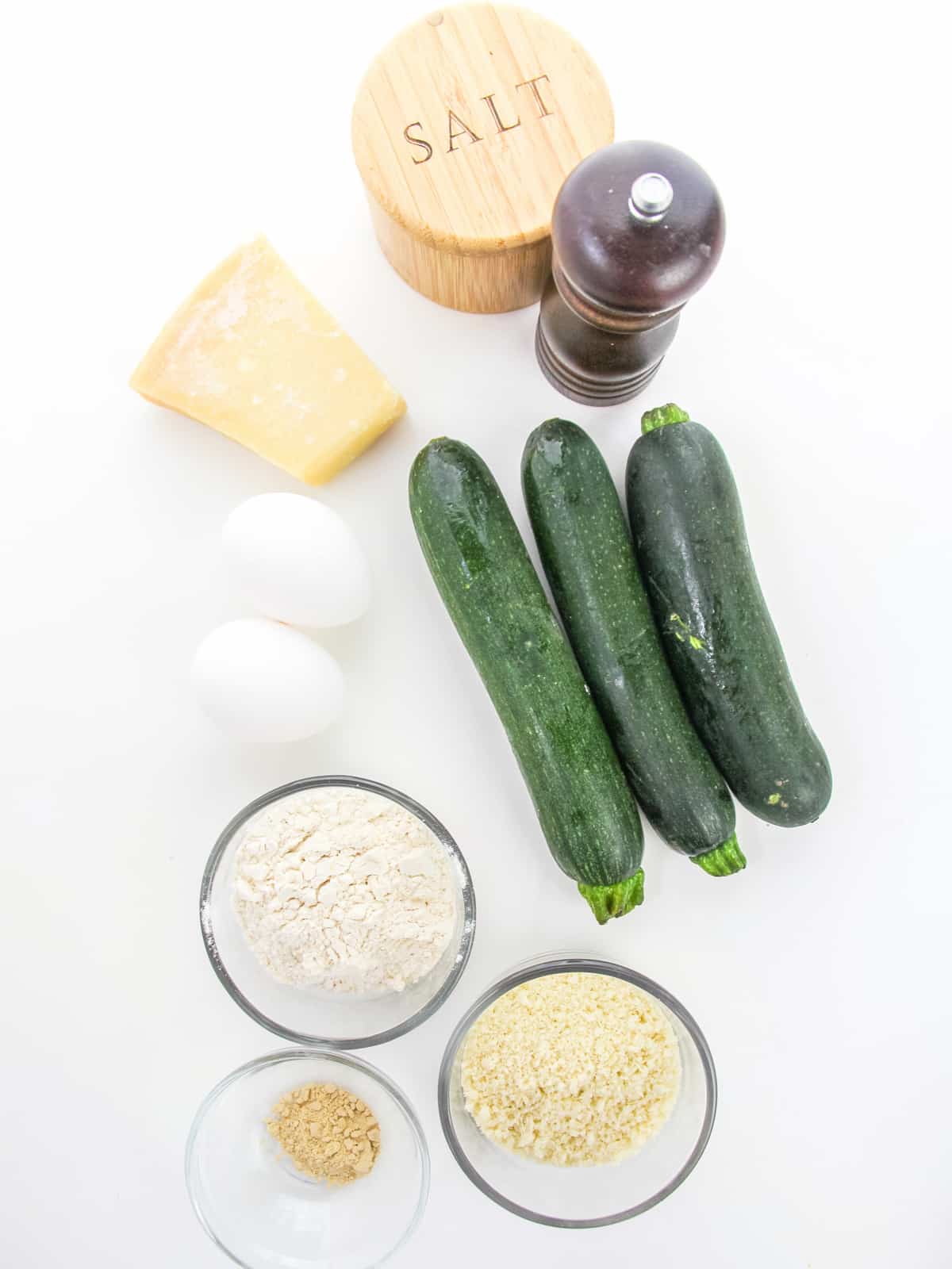 Zucchini Fritters Ingredients on a white background