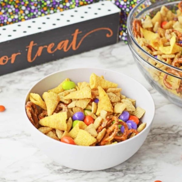 halloween chex mix in a white bowl