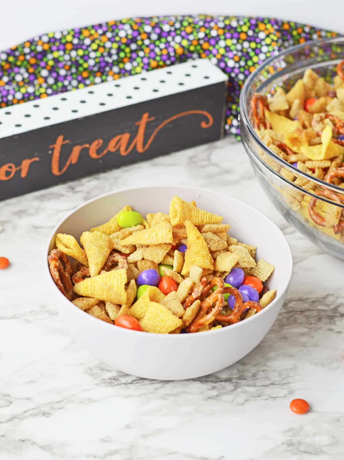 halloween chex mix in a white bowl