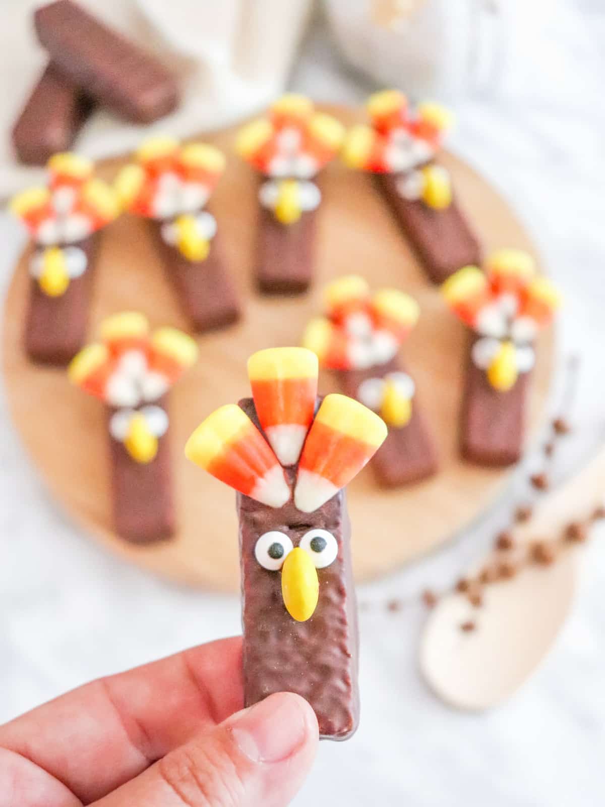 Hand holding a decorated Turkey Wafer Cookie