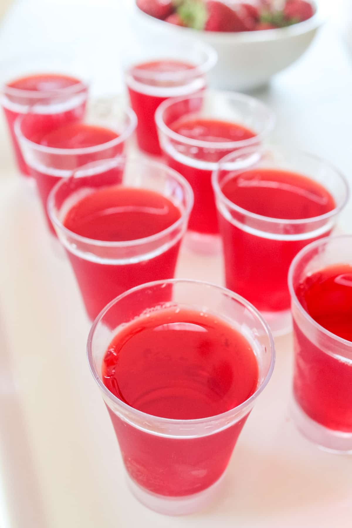 pour red jello mixture into shot cups