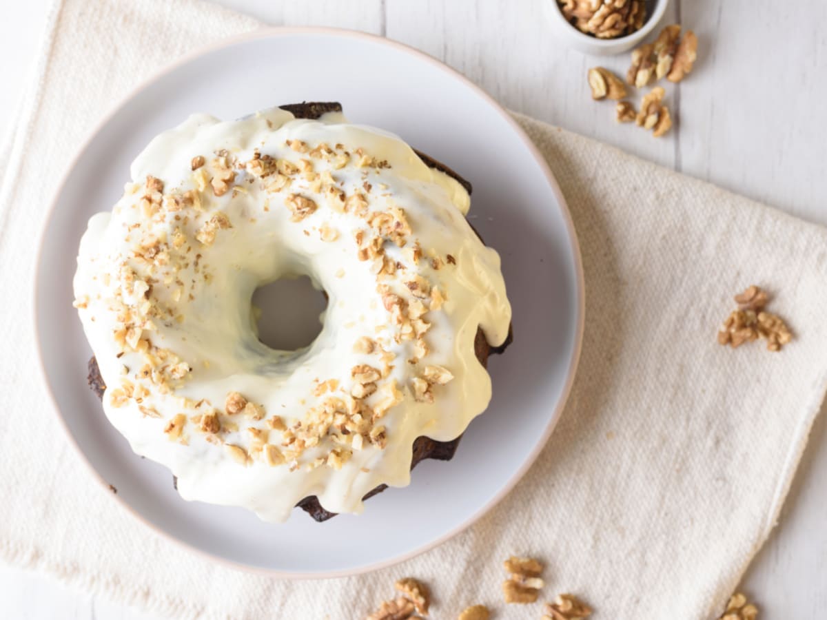 pumpkin bundt cake with cream cheese glaze and nuts
