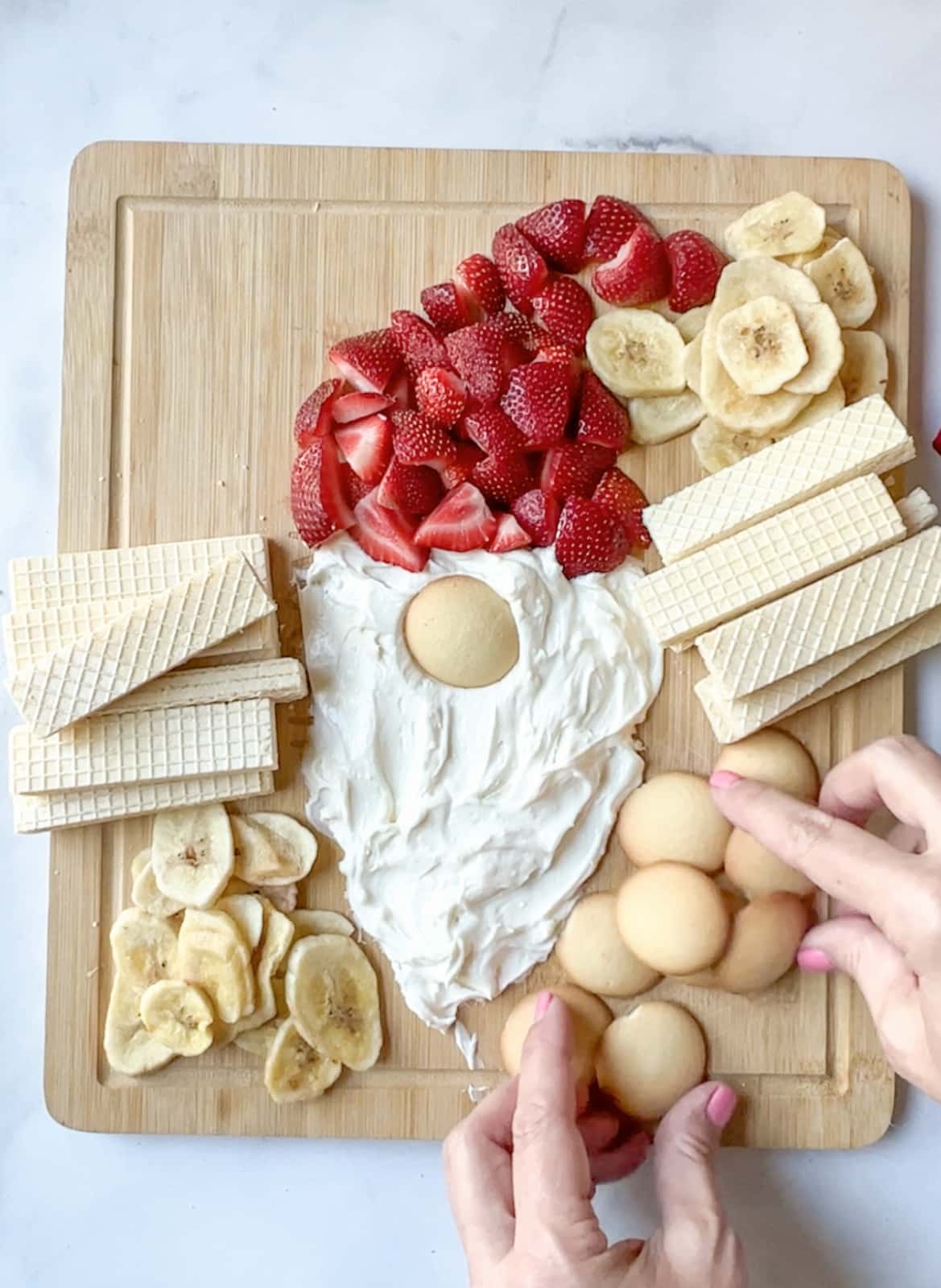 surround the gnome dip with cookies fruit and candy