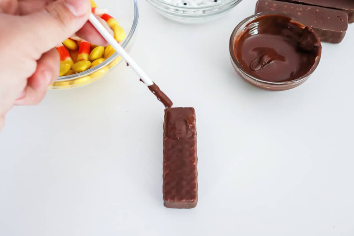 use melted chocolate to attach candy