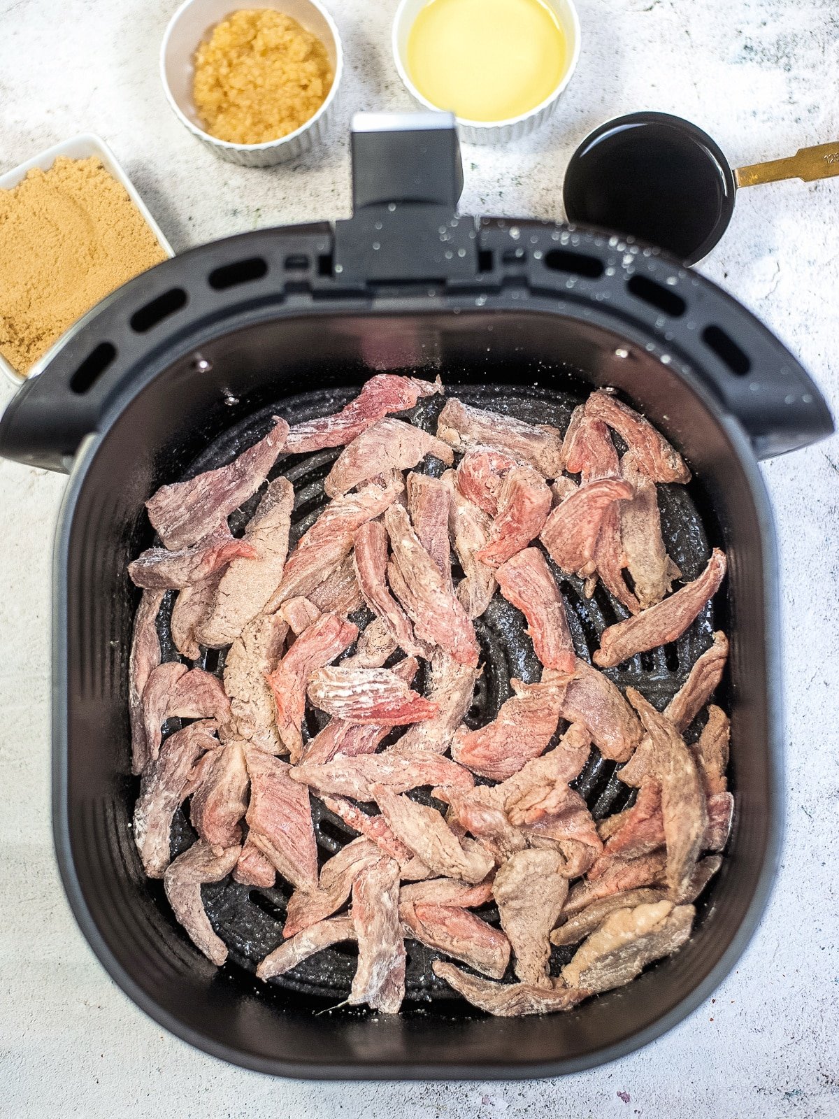 add coated beef to air fryer basket