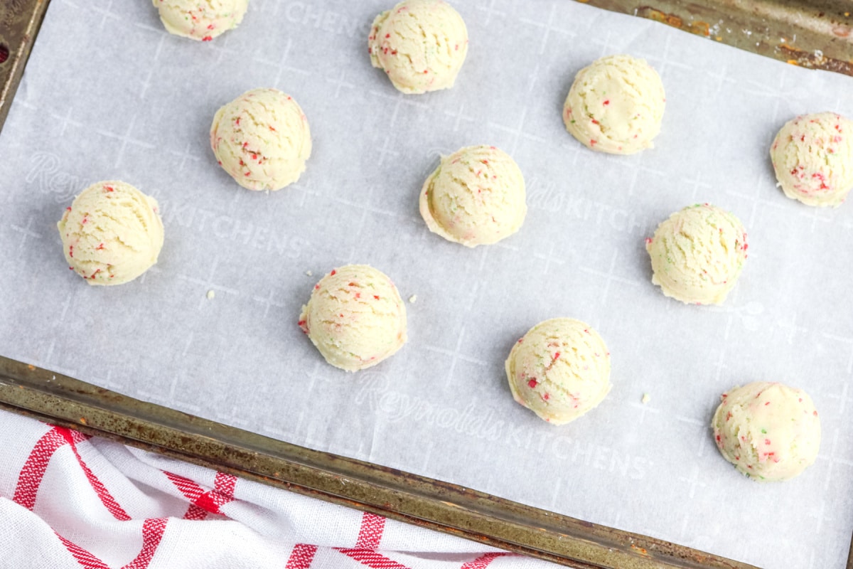 scoop cookies onto lined baking sheet