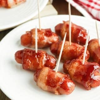 bacon smokies appetizer on a white plate