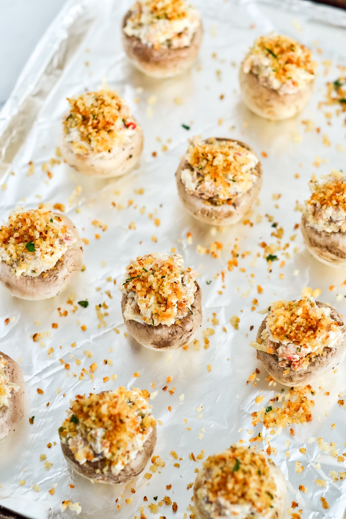 press each stuffed mushroom into the topping and return to cookie sheet