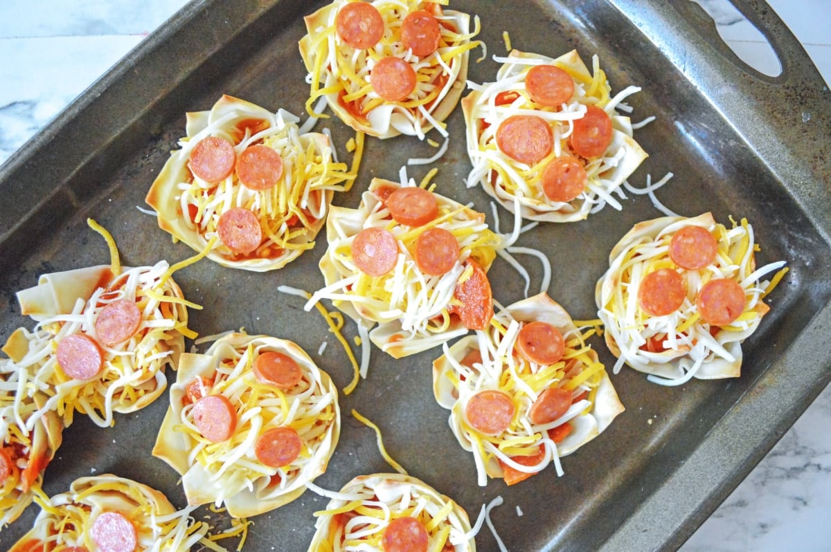 top filled wontons with cheese and mini pepperoni