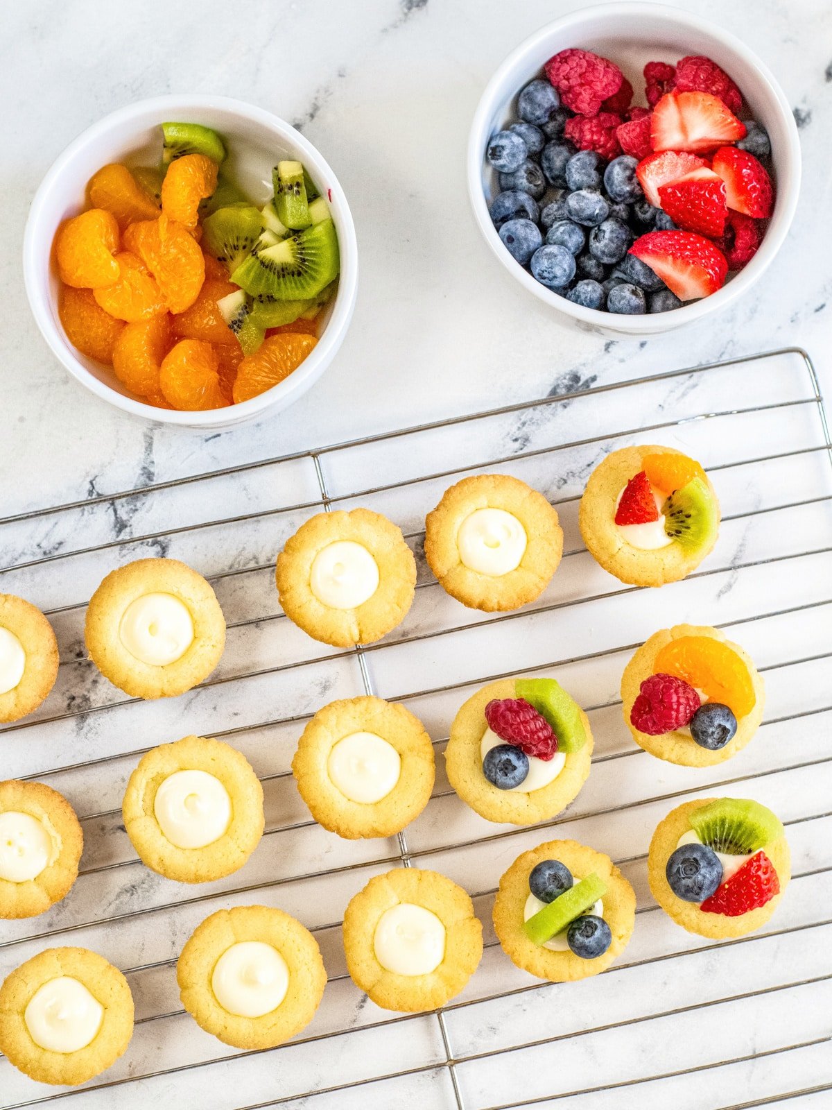dice fruit into small pieces and add to mini tarts