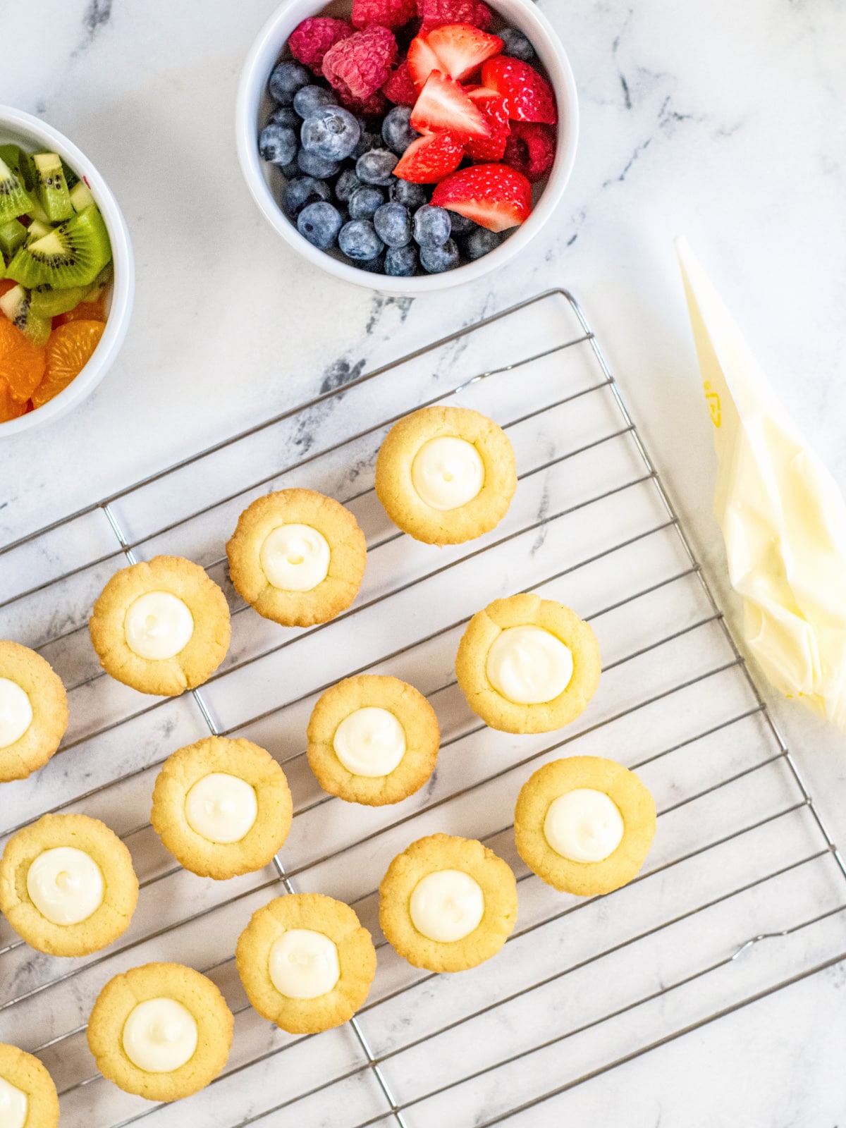 fill each mini fruit tart with the cream cheese mixture