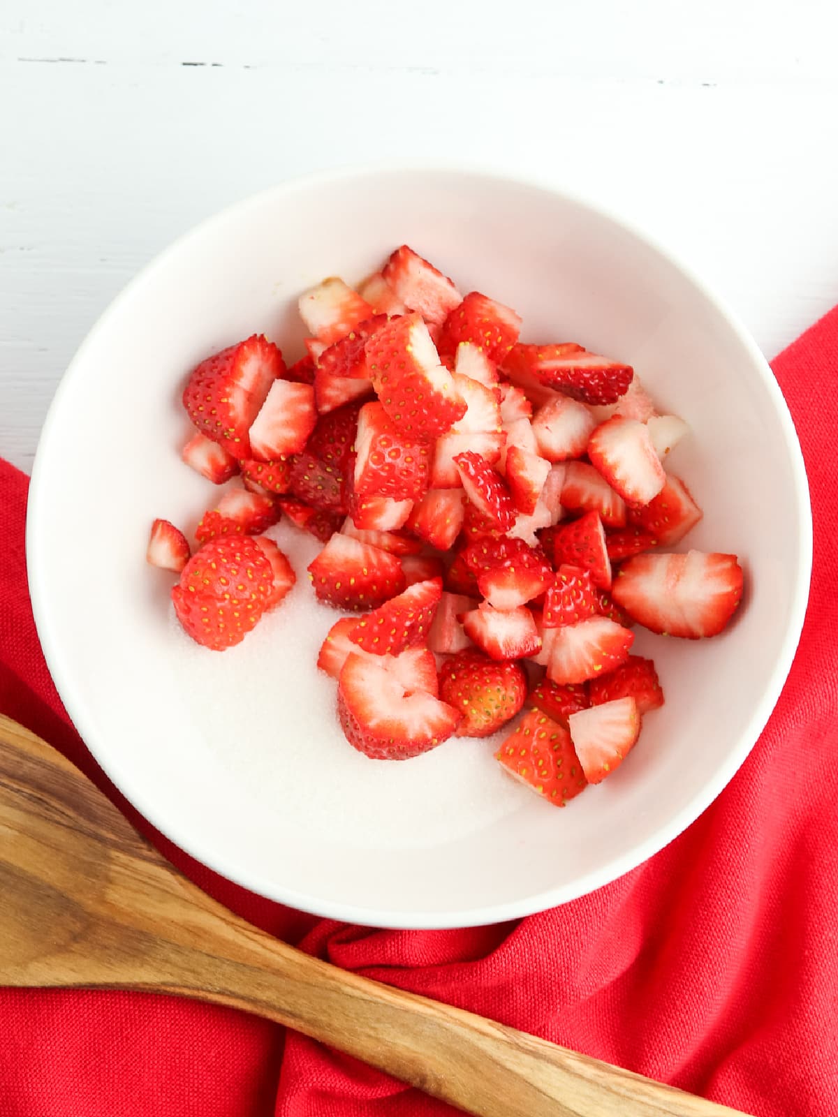 add chopped strawberries to a bowl