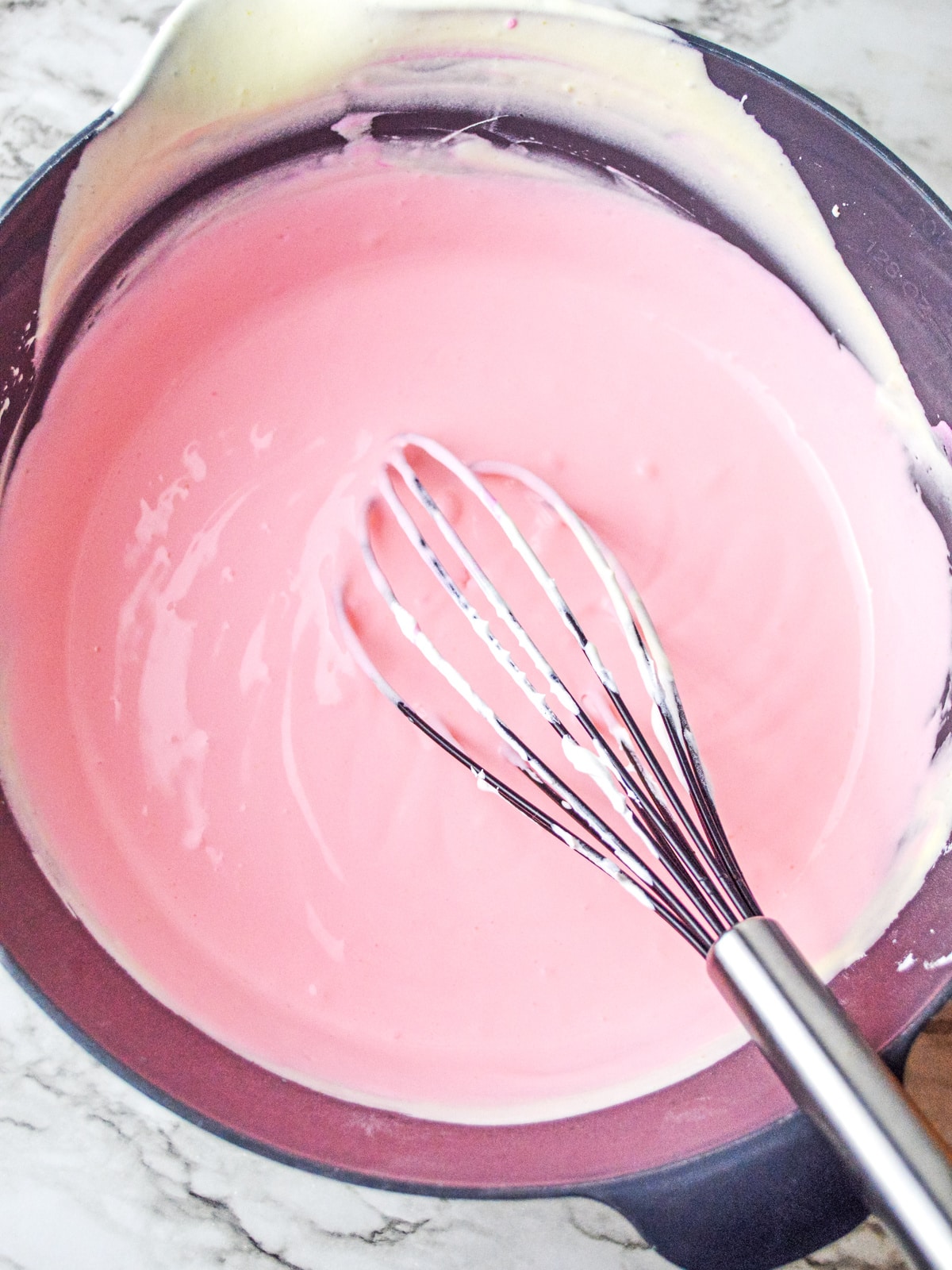 add pink food coloring to two thirds of pudding mixture
