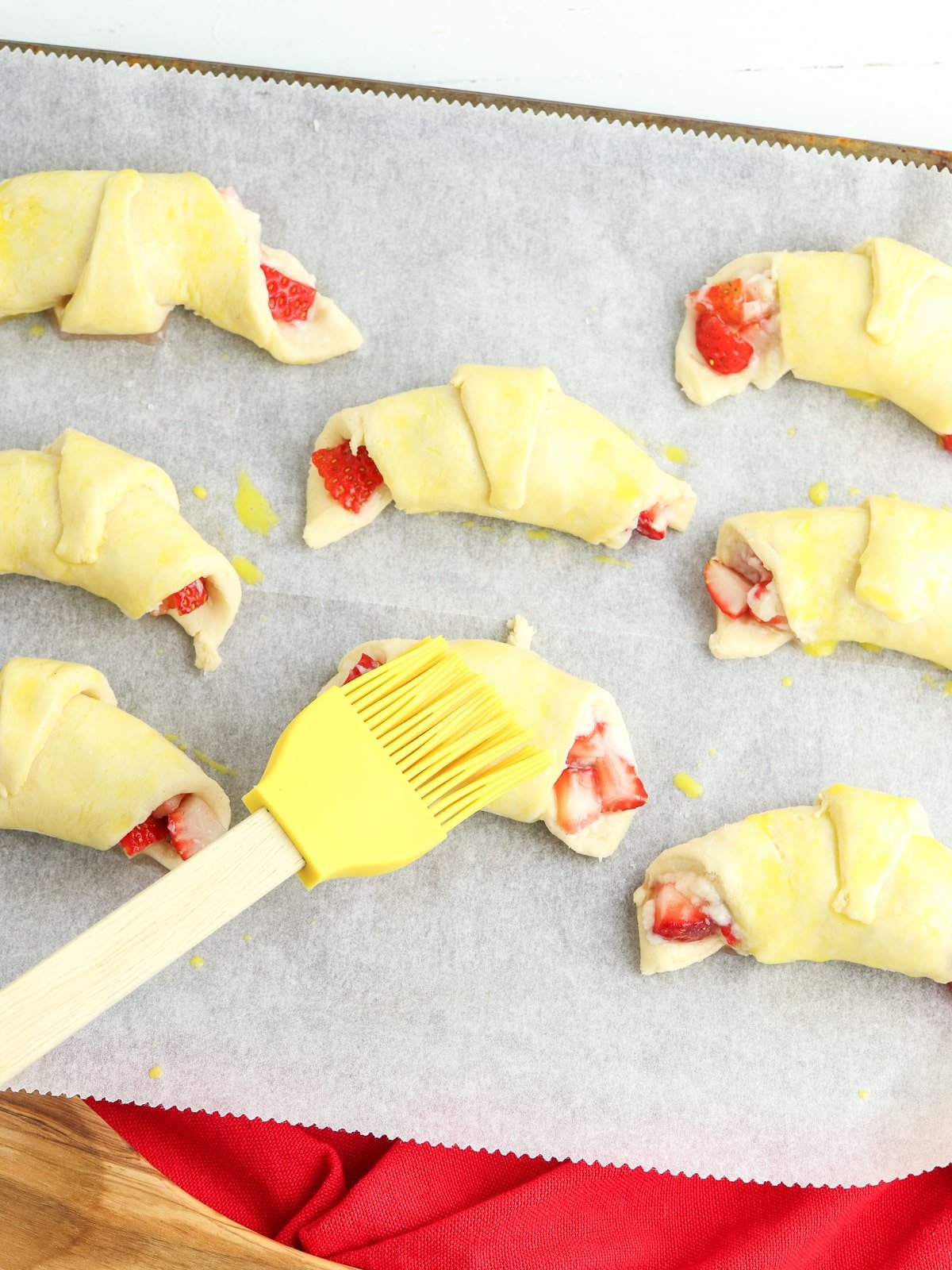 brush tops of crescent rolls with egg wash