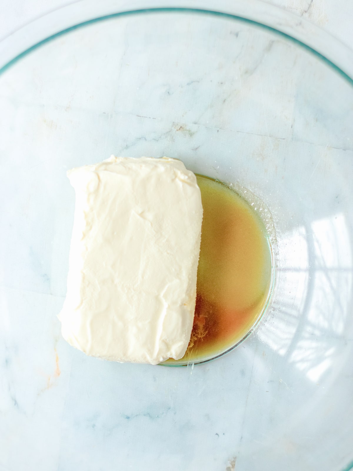 combine cream cheese with sugar and vanilla